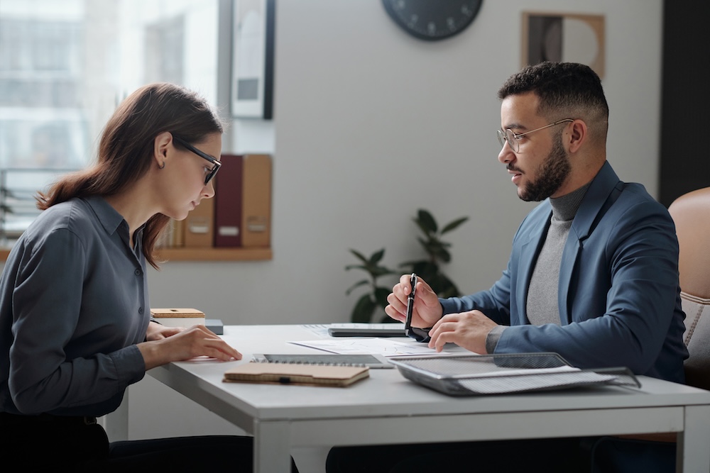 two people in a work meeting