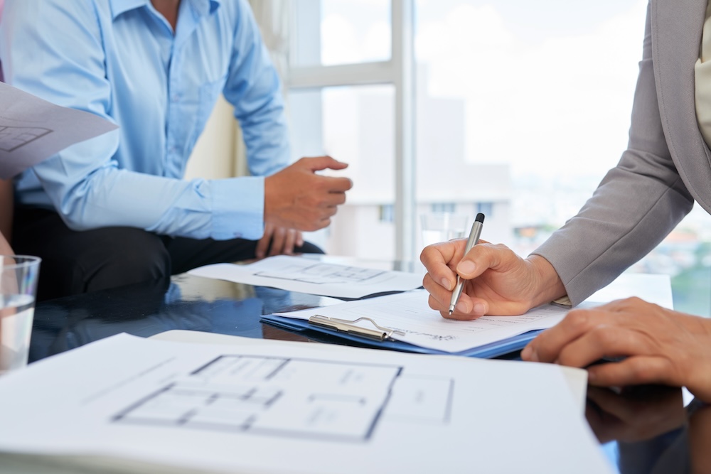 people going over loan documents