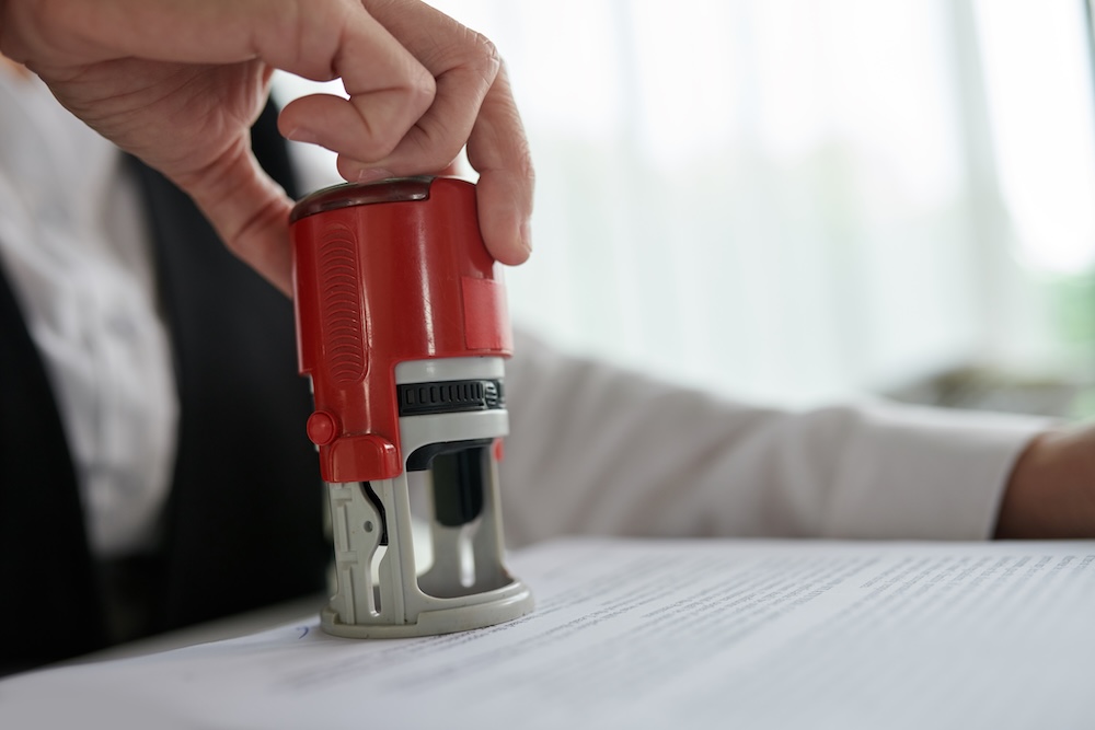 a notary stamping document