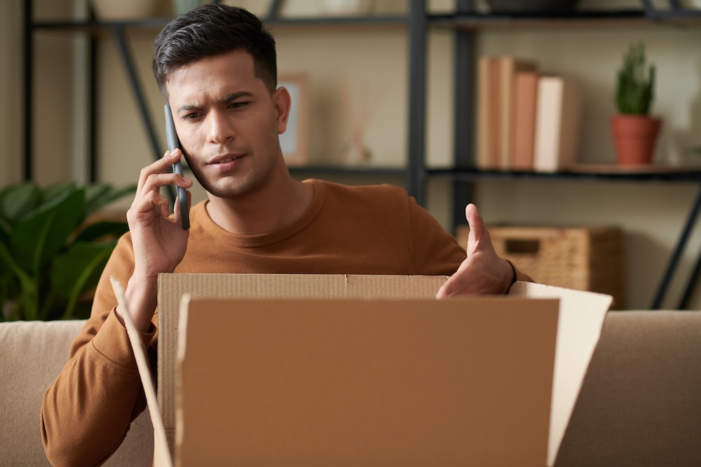 a man on the phone with a company trying to return a package